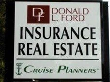 Roadside sign reading Donald L. Ford Insurance, Real Estate