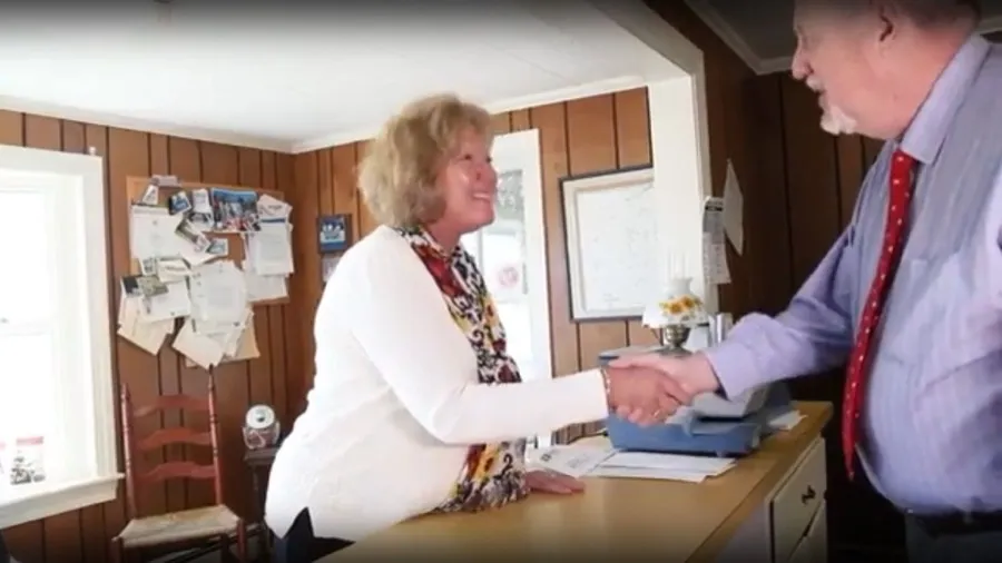 Staff member greeting a client with a handshake inside the Hanson office